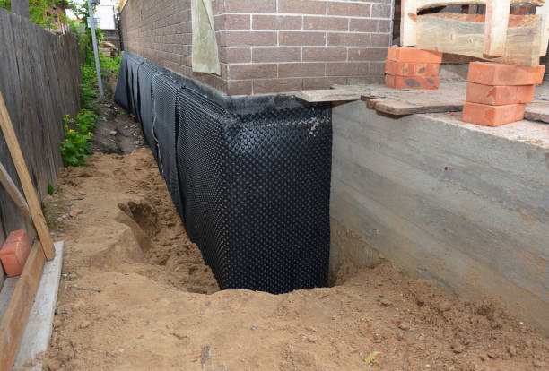 Happy homeowners after waterproofing job in Greeneville